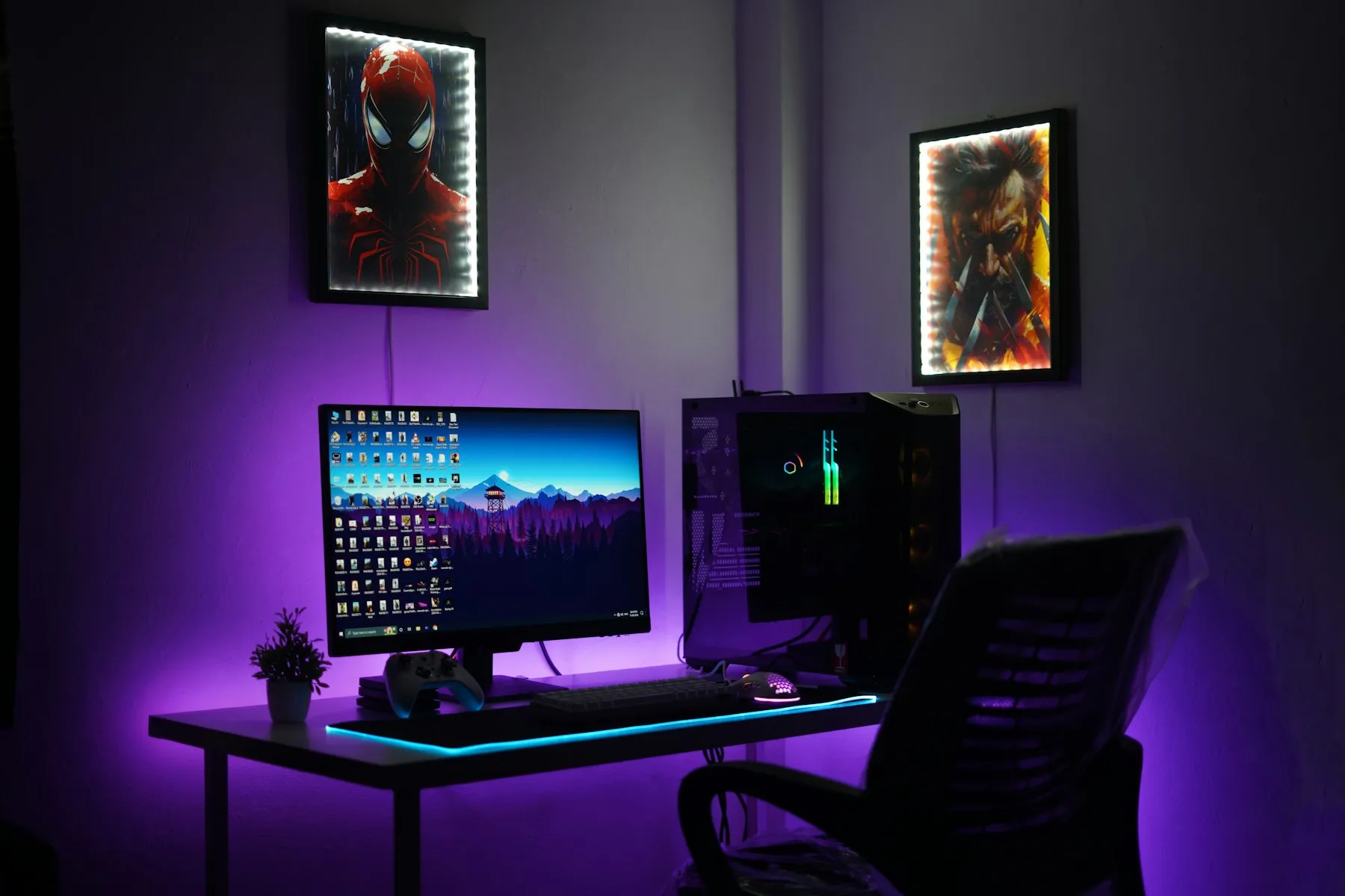 A desk with two monitors in a room lit by purple LEDs