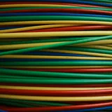 A tight bundle of brightly coloured cables running side by side